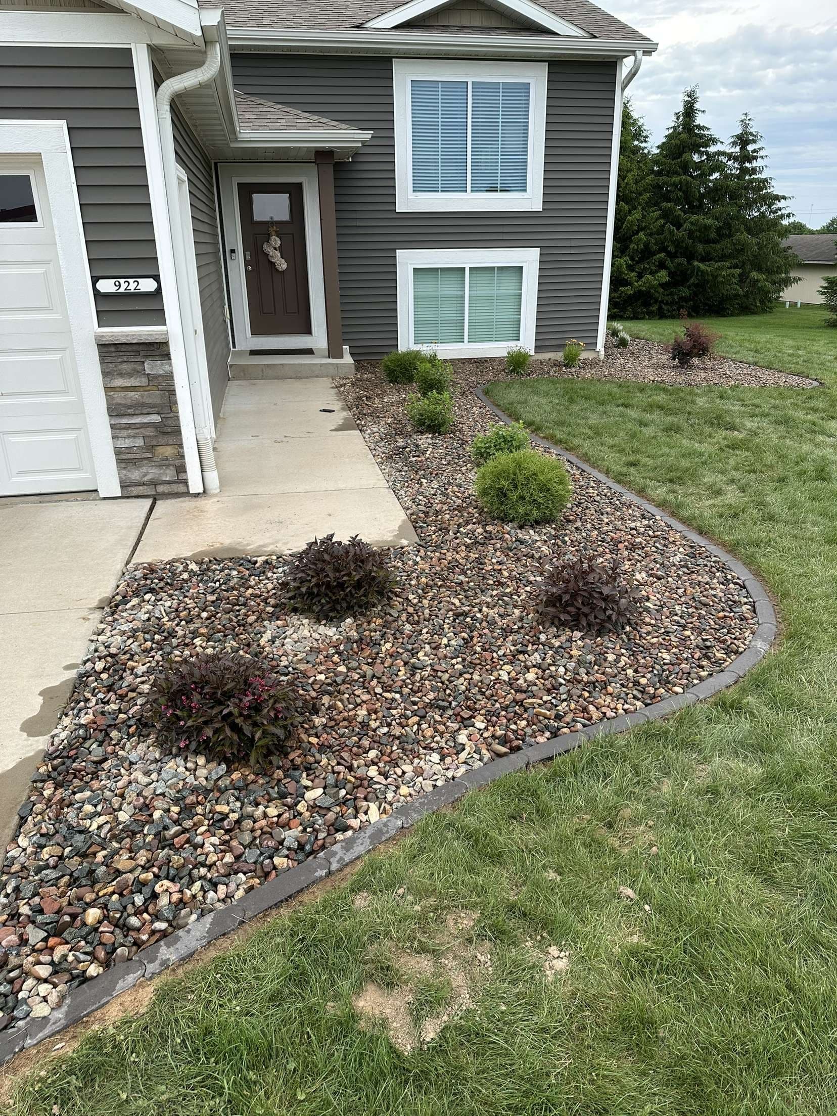 Sod Removal to Rock Beds with Brick Edging and Plants image