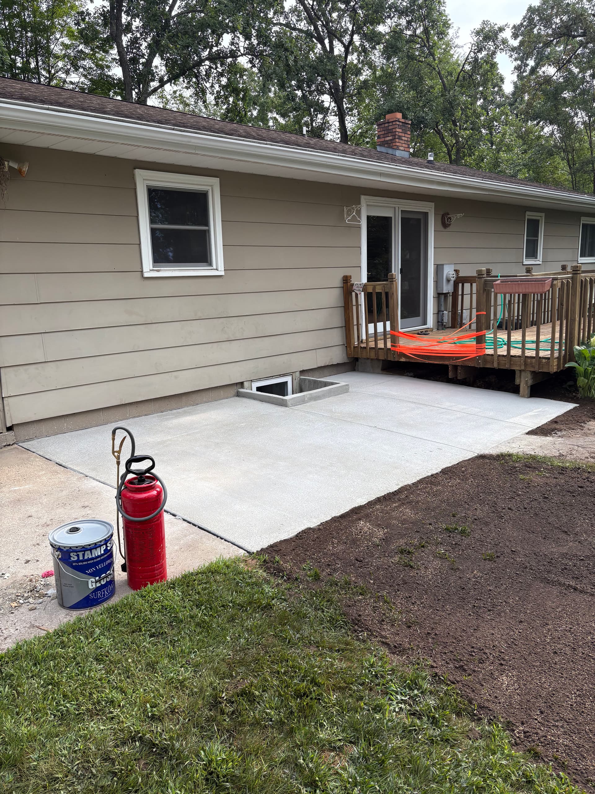 Backyard Patio Extension and Concrete Window Well Replacement