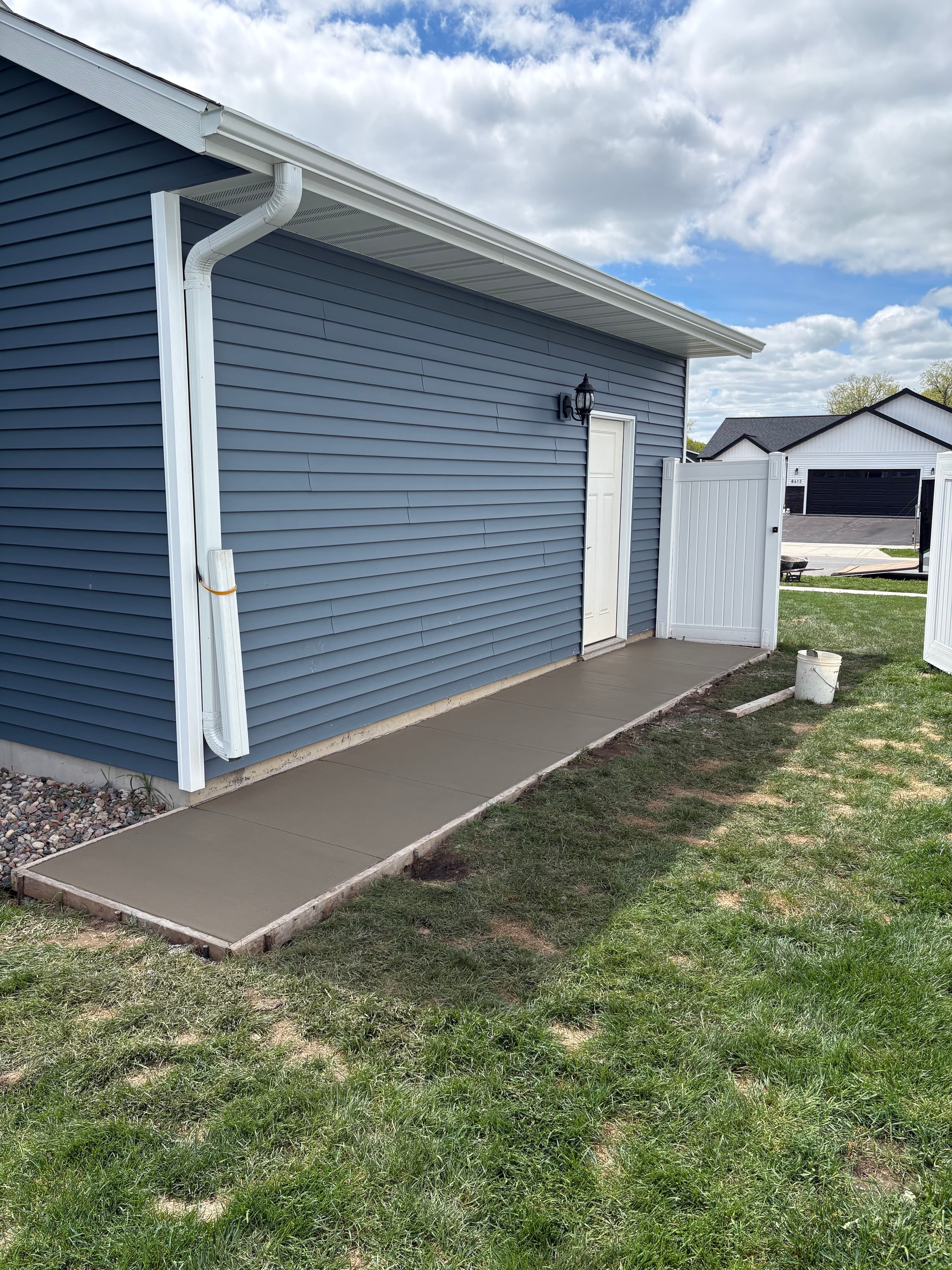 Project Concrete Walkway Solves Drainage Problems at Garage Side Door image