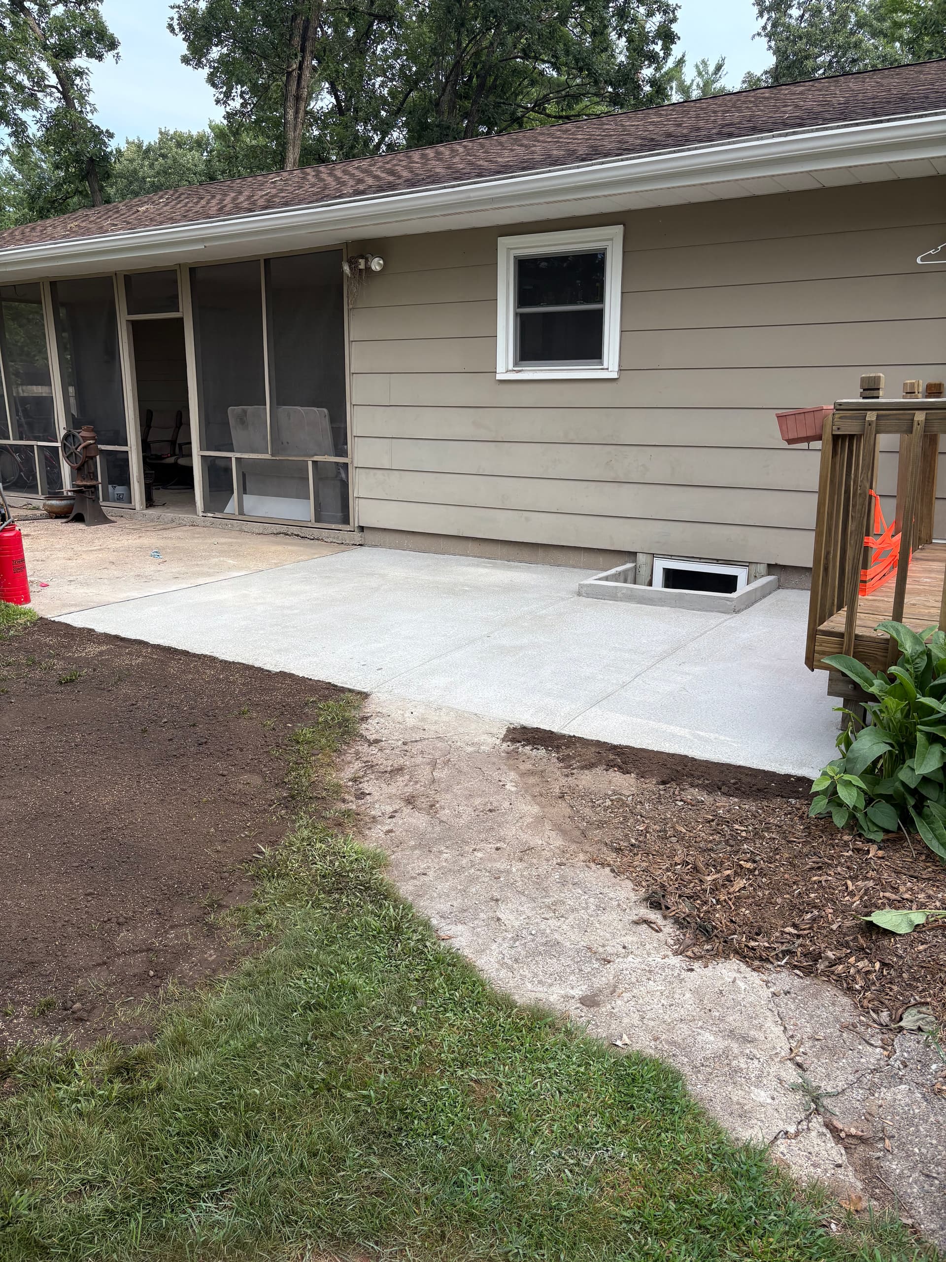 Backyard Patio Extension and Concrete Window Well Replacement