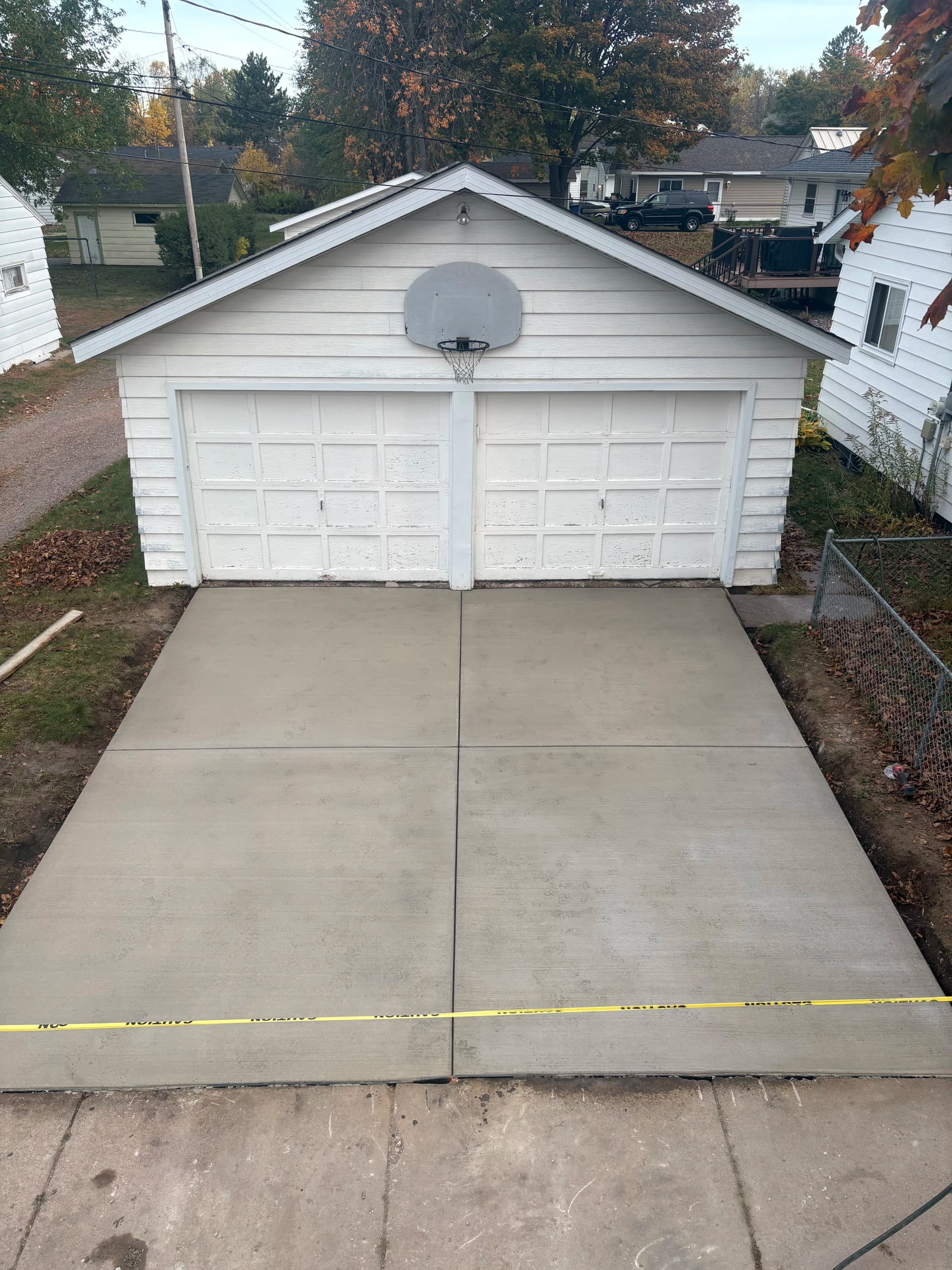 Gallery photos for Crumbling Garage Approach Gets a Fresh Concrete Driveway Replacement: Image #1
