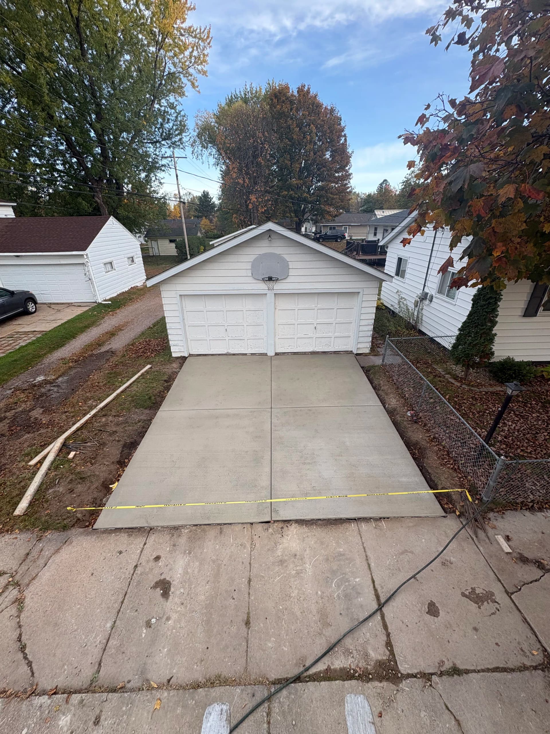 Crumbling Garage Approach Gets a Fresh Concrete Driveway Replacement image