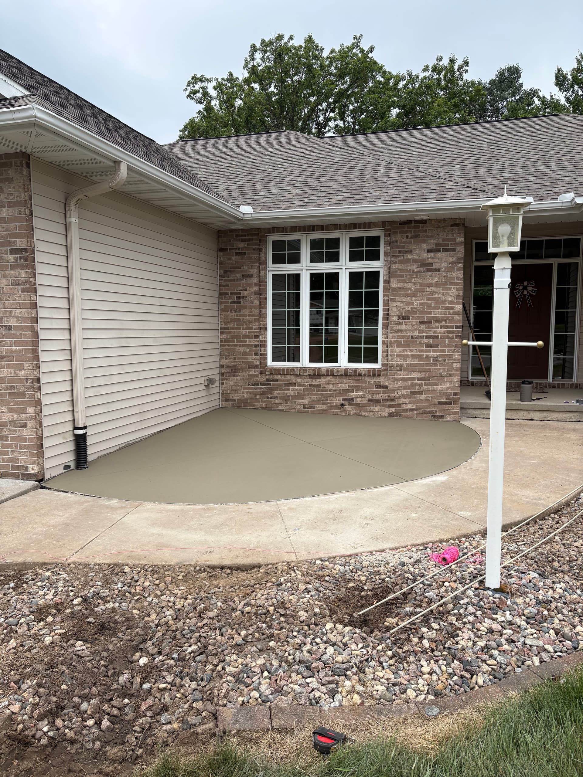 Concrete Flatwork Solves a Garage Water Drainage Problem image