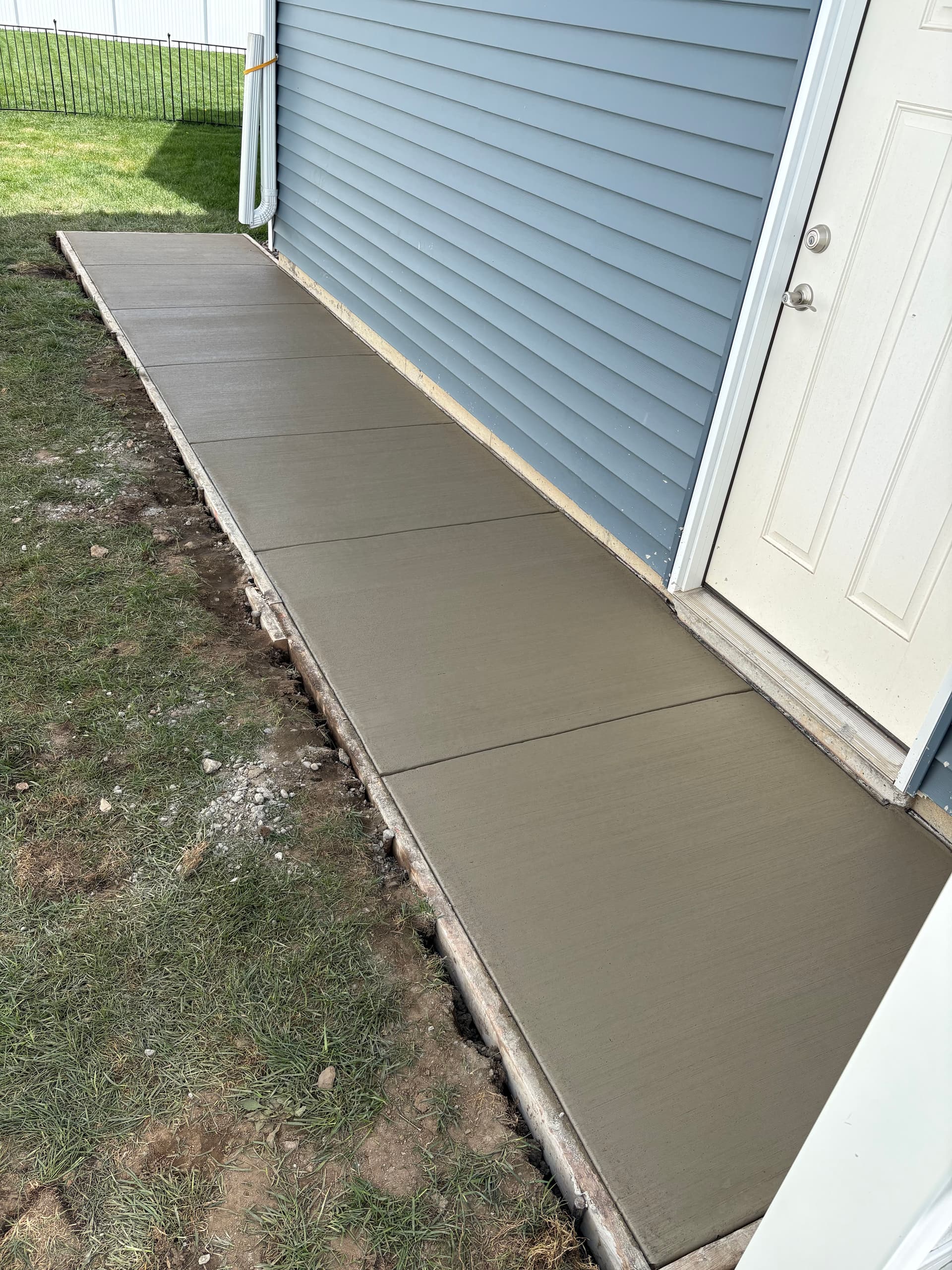 Gallery photos for Concrete Walkway Solves Drainage Problems at Garage Side Door: Image #2