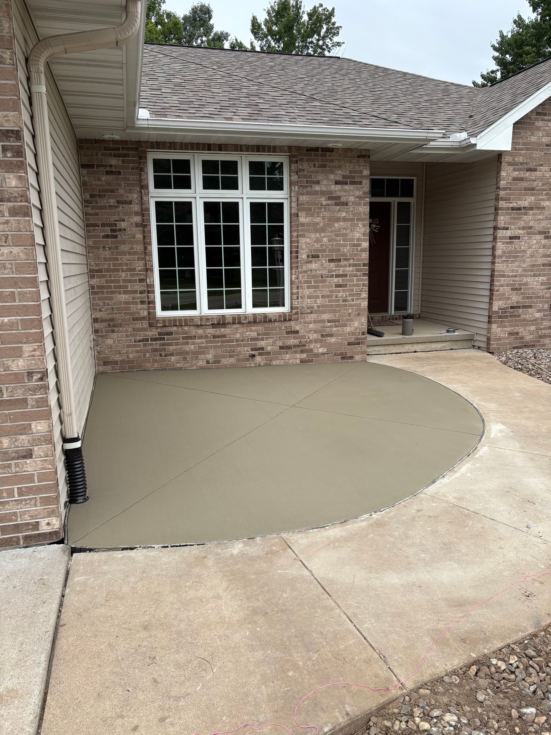 Gallery photos for Concrete Flatwork Solves a Garage Water Drainage Problem: Image #1