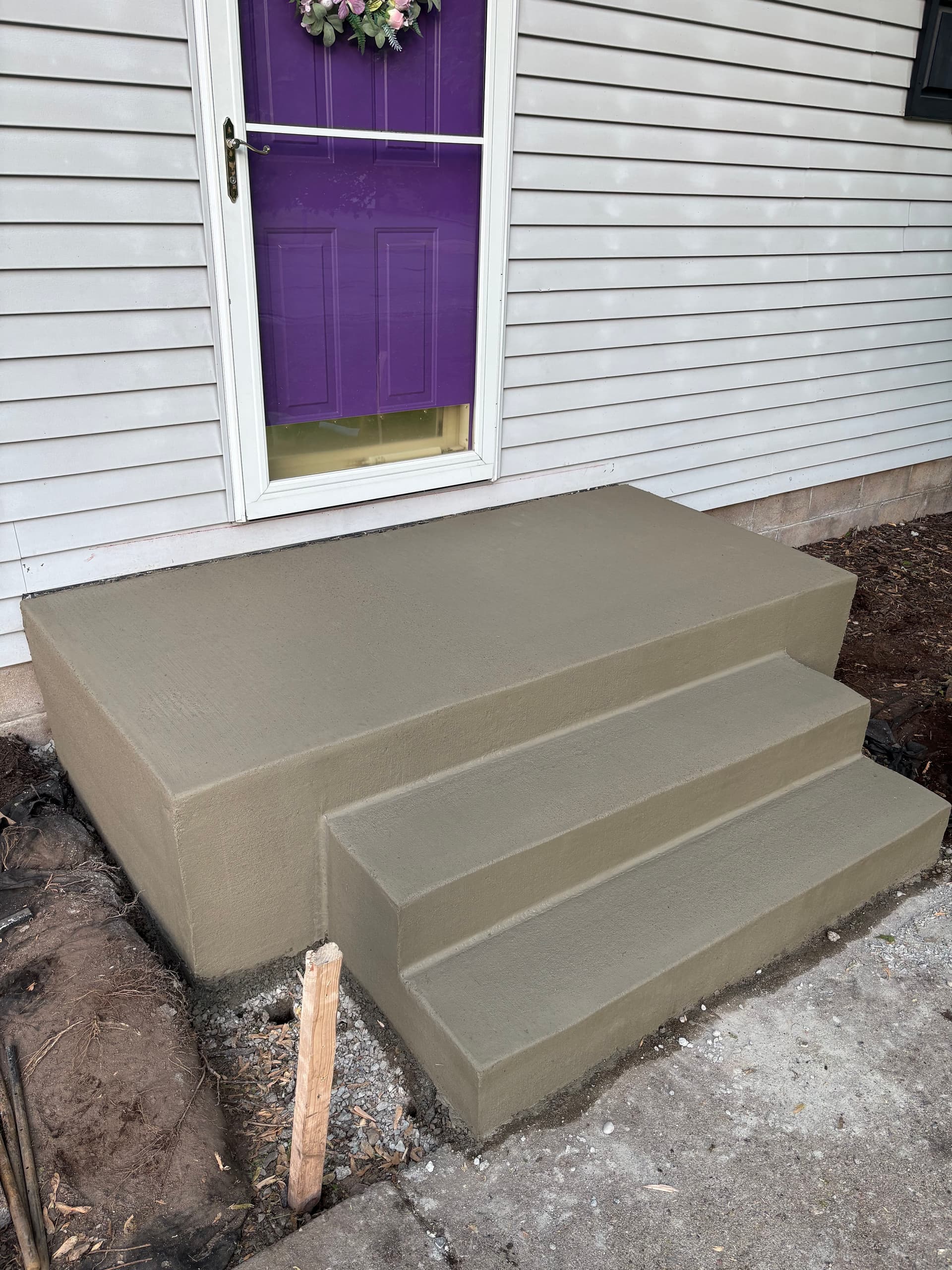 Gallery photos for Old Precast Steps Out, Fresh Poured Concrete Entry In: Image #3