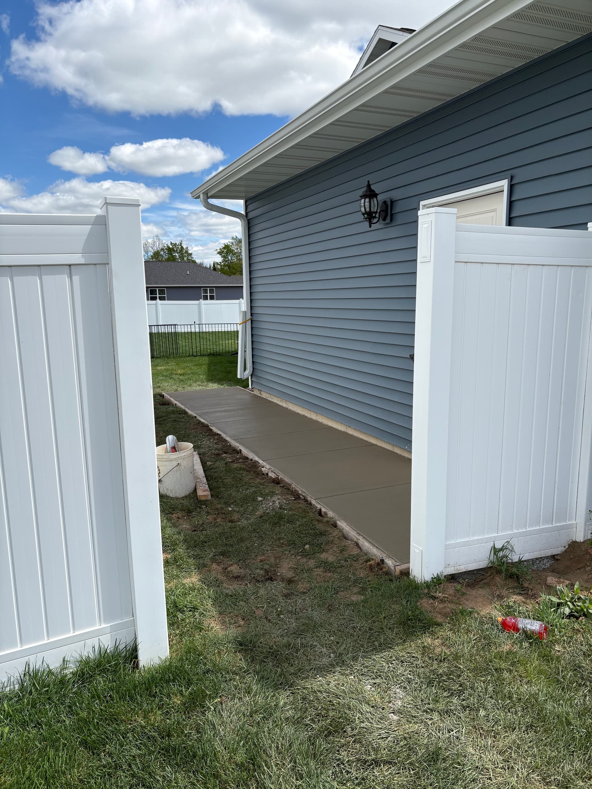 Gallery photos for Concrete Walkway Solves Drainage Problems at Garage Side Door: Image #1